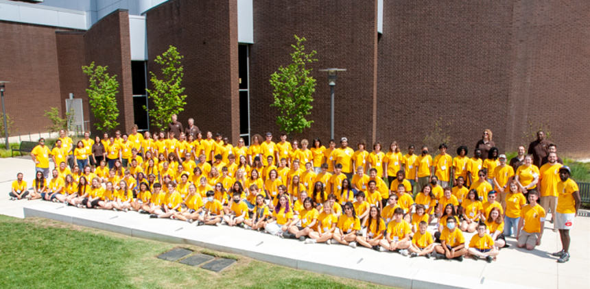 a group of campers in yellow t-shirts