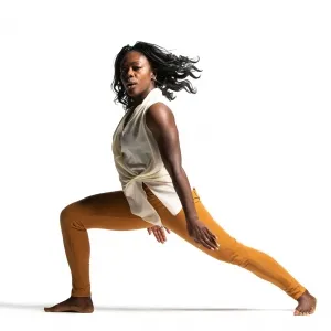 Christal Brown posing in a lunge position facing the camera