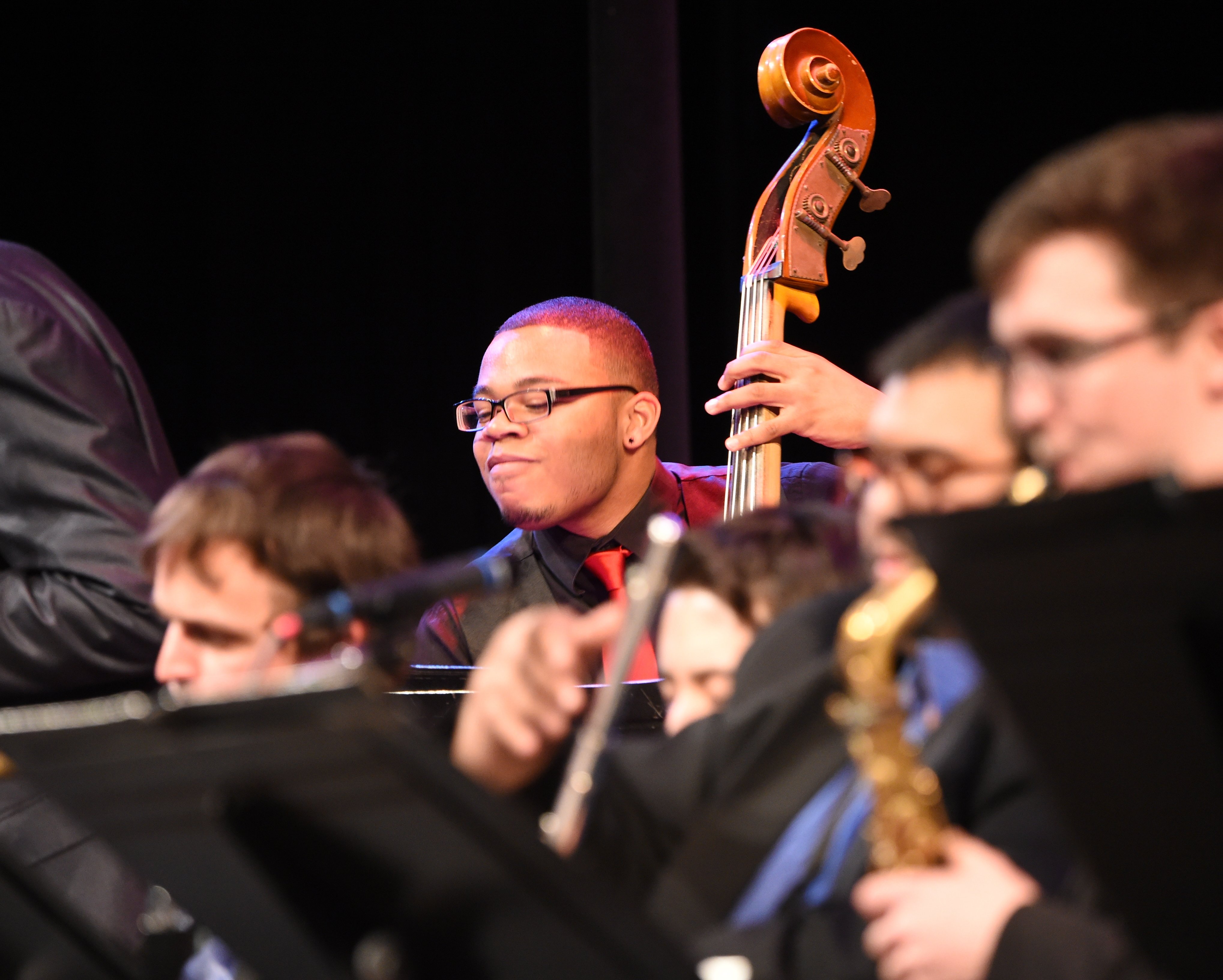 Jazz Ensemble Performing, Close up on Bass Player