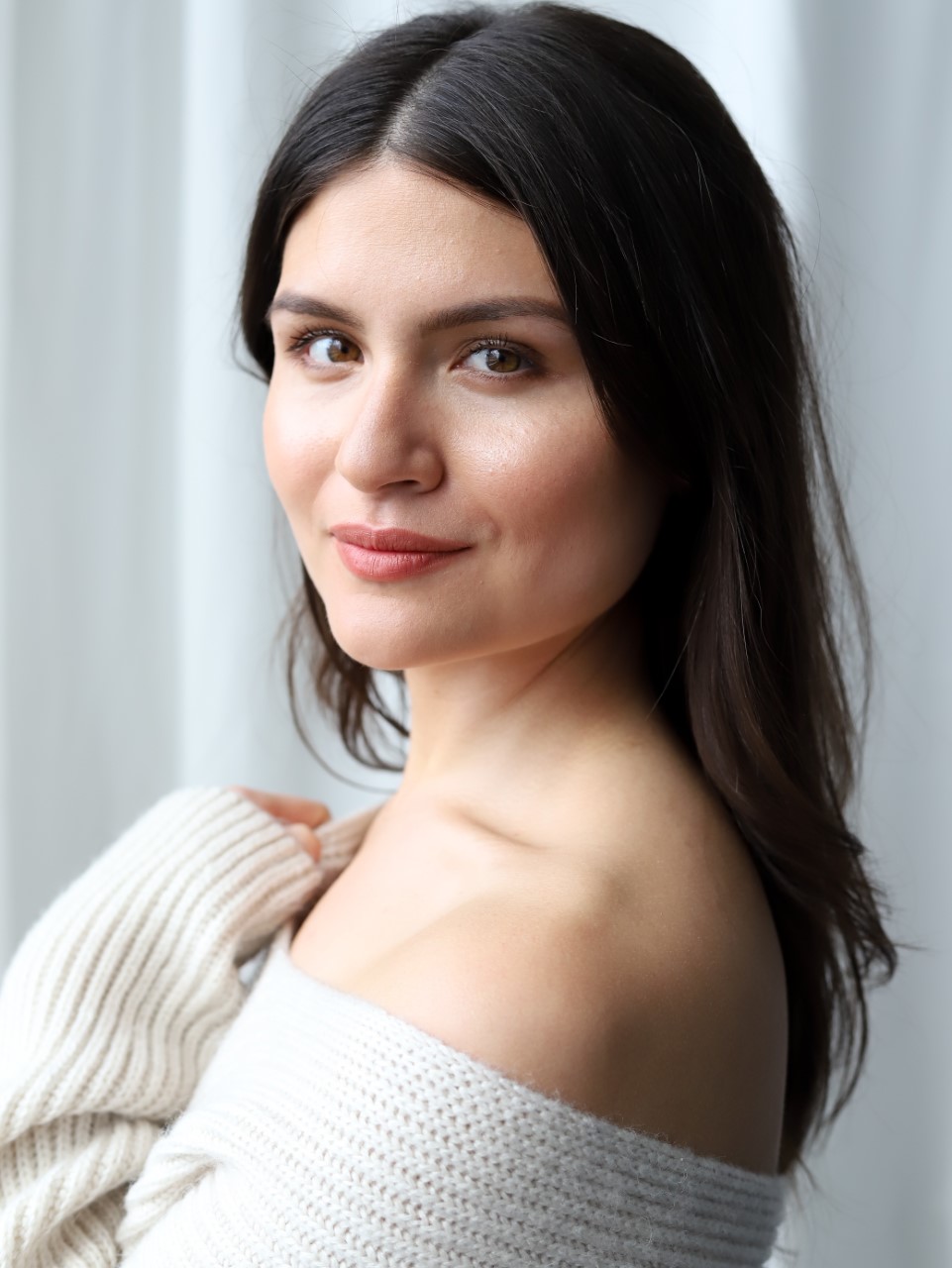 Phillipa Soo headshot. She is wearing a beige off-the-shoulder sweater.