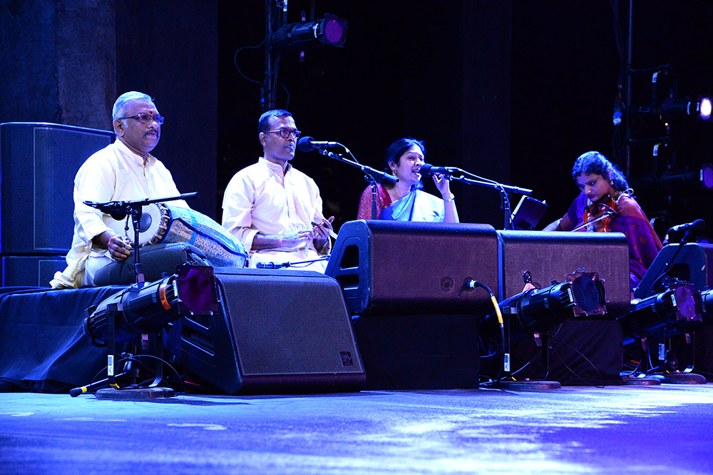 2. A carnatic ensemble performs on the side of the stage.